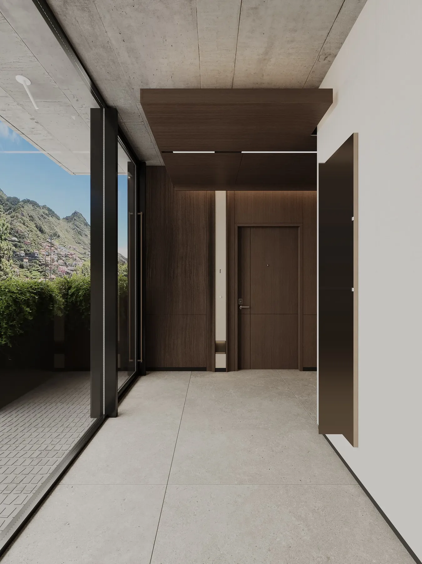 The entrance hall with a glass wall to the hills