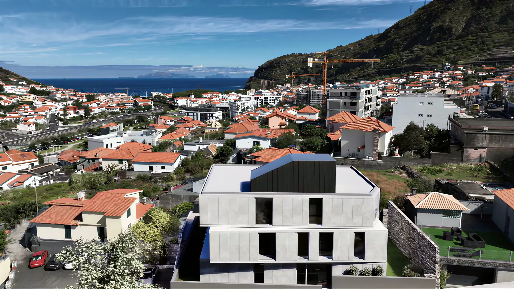 The house above the town and the bay of Machico, drone photograph with the architect's visualisation set in