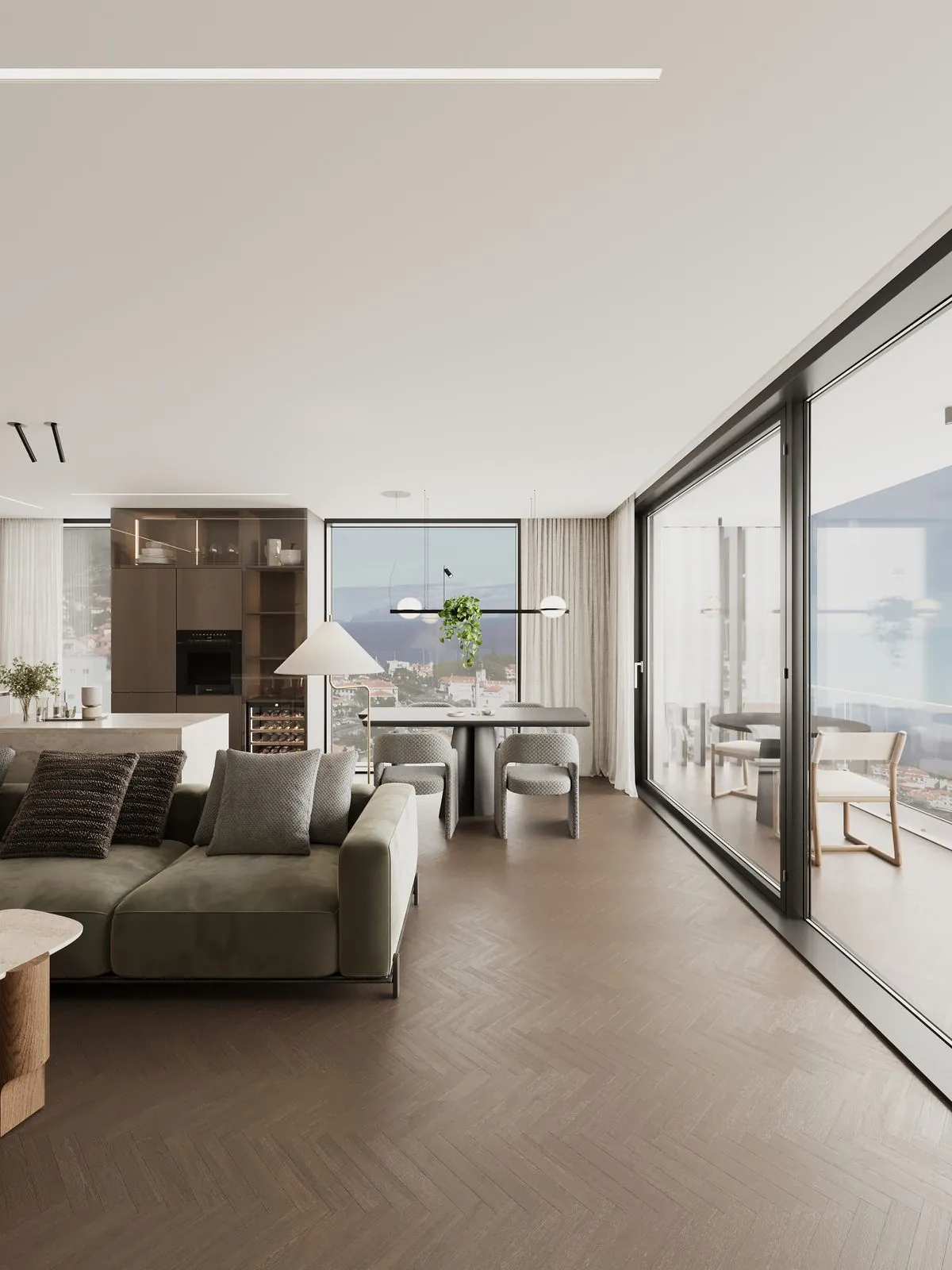 The sofa, the dining table by the window and the glass door to the terrace