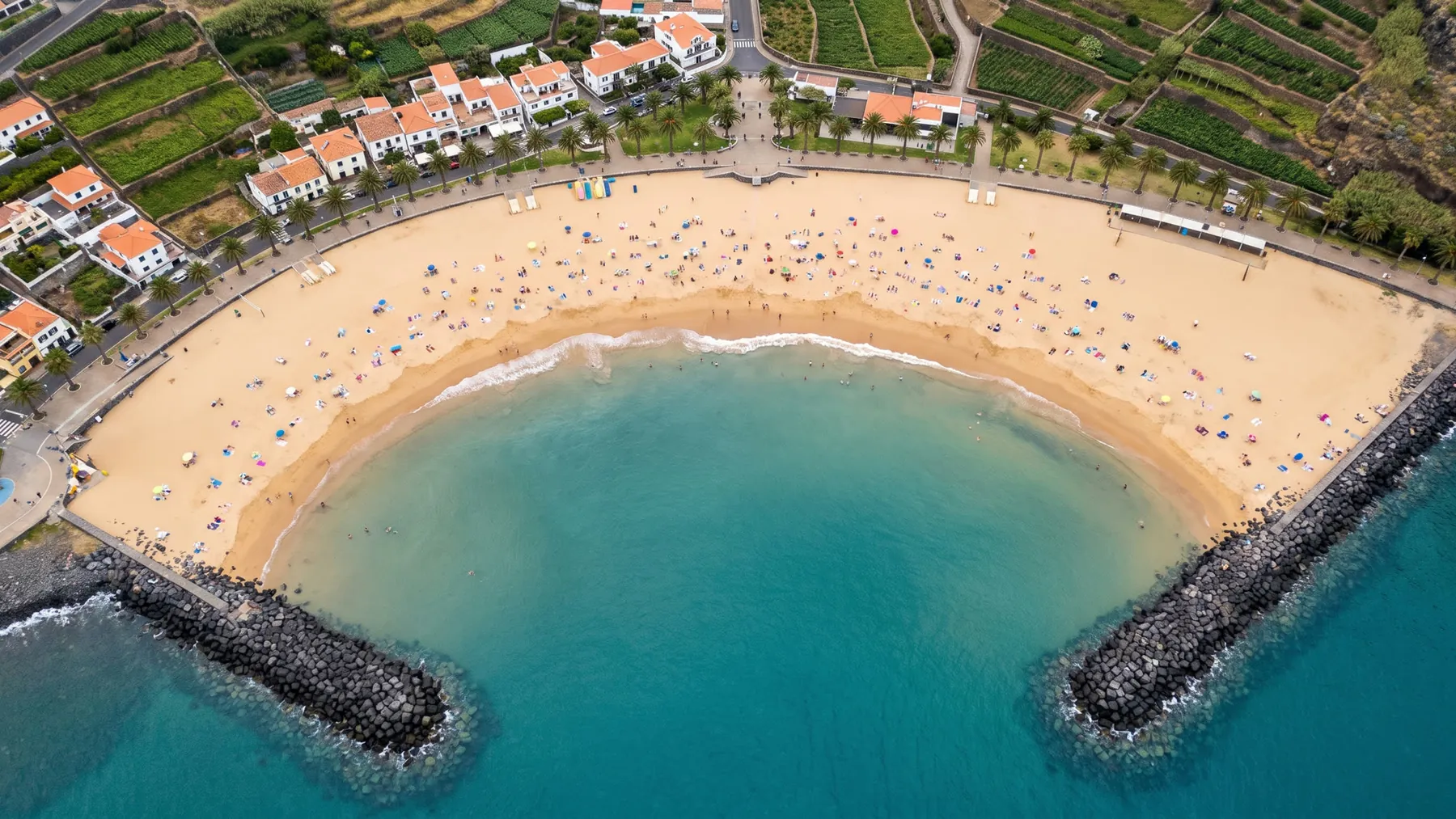The sandy beach in the bay of Machico from above