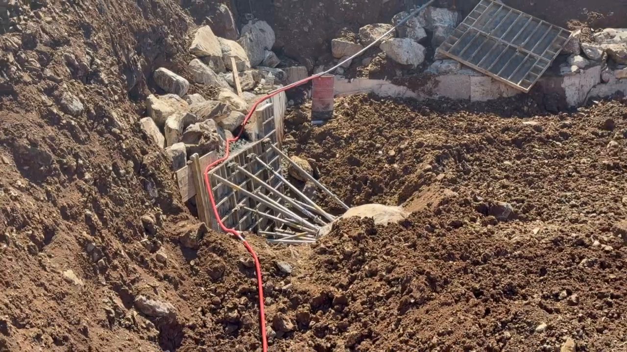 Formwork for the first retaining wall against the slope