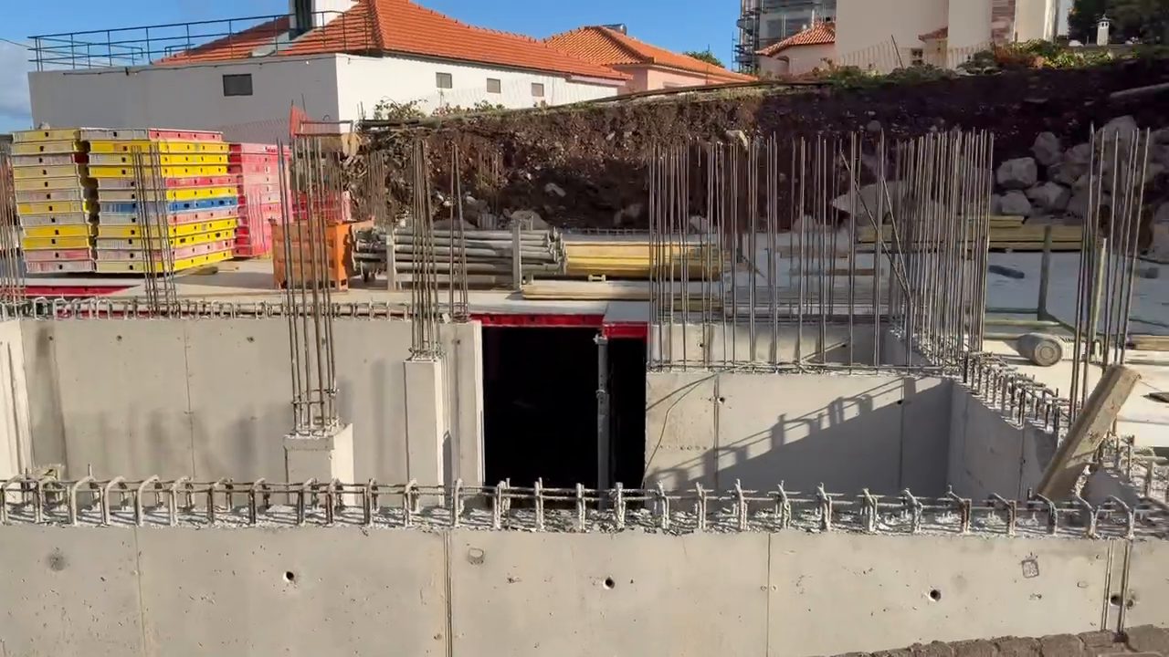 Concrete walls of the garage level